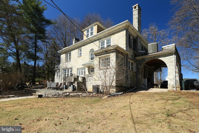 234 W Fairmount Ave, State College, PA 16801 - back of property featuring stone siding, a chimney, and a yard