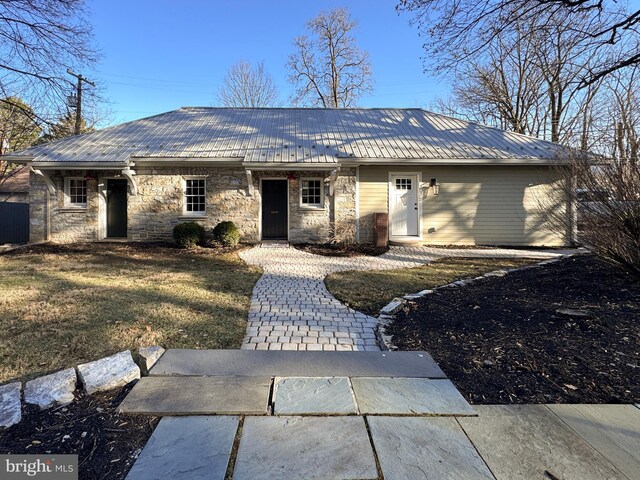 234 W Fairmount Ave, State College, PA 16801 - ranch-style home featuring stone siding, metal roof, and a front lawn