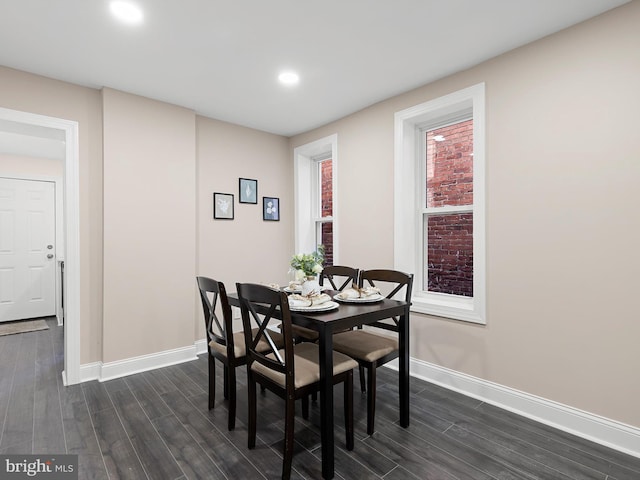 dining area featuring recessed lighting, baseboards, and dark wood-style floors