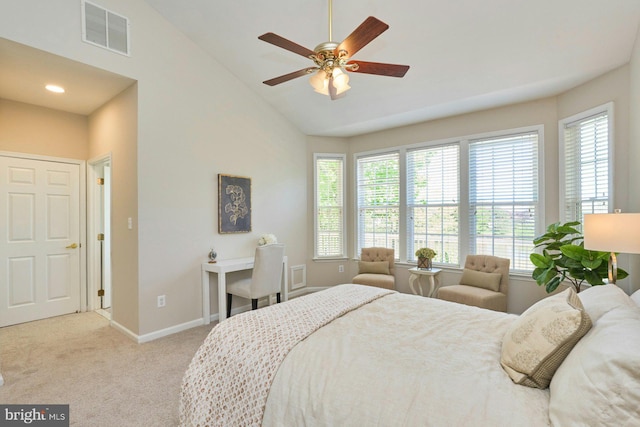 carpeted bedroom with baseboards, visible vents, multiple windows, and high vaulted ceiling