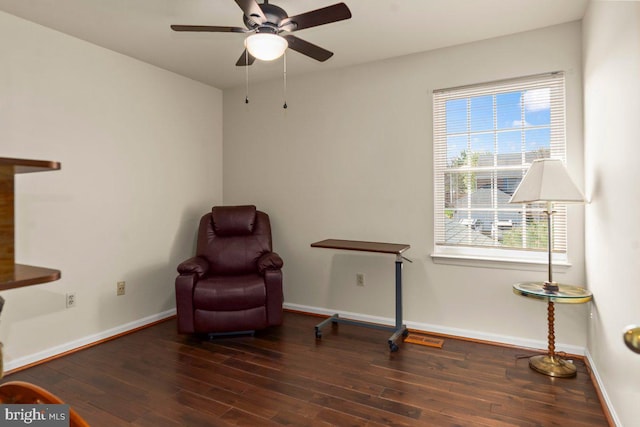 unfurnished room with wood finished floors, baseboards, a ceiling fan, and a wealth of natural light