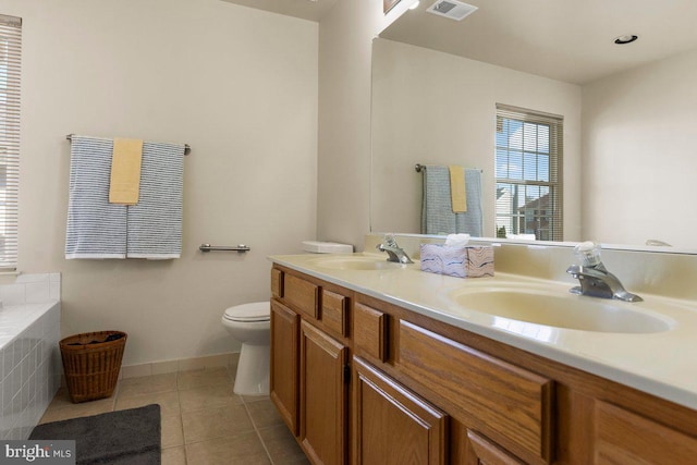 bathroom with tile patterned flooring, visible vents, a sink, and toilet