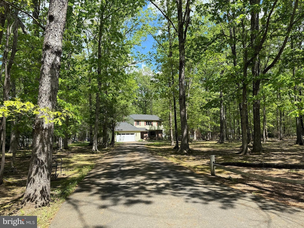 view of front of house featuring asphalt driveway