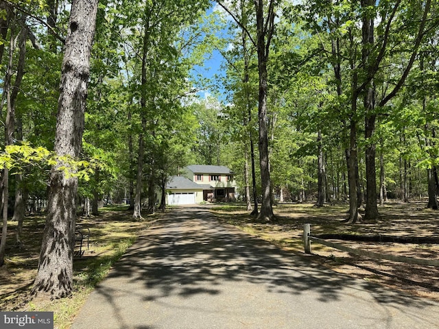 view of front of house featuring asphalt driveway