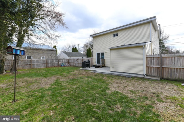 back of property featuring a lawn, a fenced backyard, entry steps, and a patio area