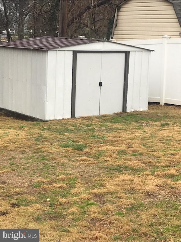 view of shed with fence