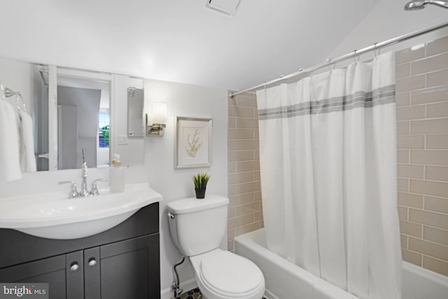 full bathroom with shower / tub combo, vanity, and toilet