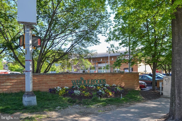 community sign with fence