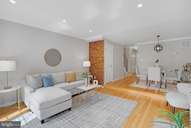 living room with stairway, ornamental molding, wood finished floors, recessed lighting, and baseboards