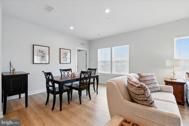 dining room with recessed lighting, baseboards, visible vents, and light wood-type flooring