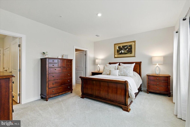 bedroom featuring visible vents, baseboards, recessed lighting, and light colored carpet
