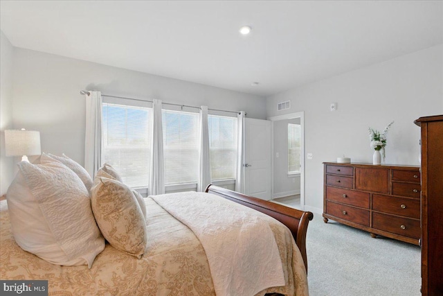 carpeted bedroom with recessed lighting and visible vents