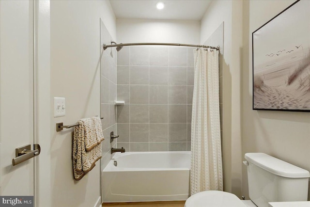 full bath with shower / bathtub combination with curtain and toilet