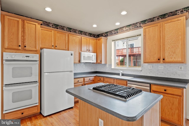 13604 Red Squirrel Way, Herndon, VA 20171 - kitchen with white appliances, a sink, dark countertops, light wood-style flooring, and backsplash
