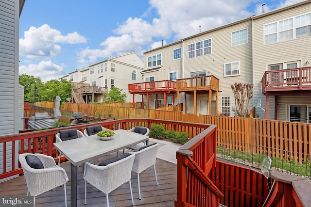 13604 Red Squirrel Way, Herndon, VA 20171 - wooden terrace featuring a residential view, outdoor dining space, and fence