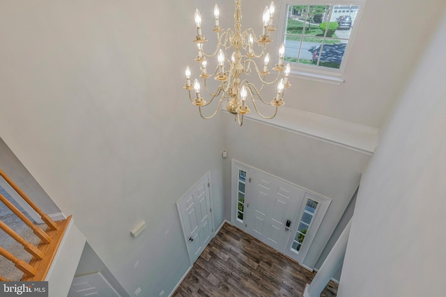11587 Wollaston Cir, Swan Point, MD 20645 - entryway featuring a chandelier, wood finished floors, stairs, and a high ceiling