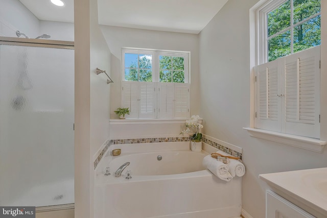 11587 Wollaston Cir, Swan Point, MD 20645 - bathroom featuring a stall shower, a bath, and vanity