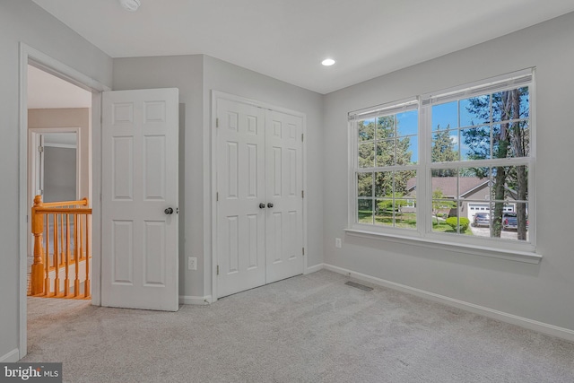 11587 Wollaston Cir, Swan Point, MD 20645 - unfurnished bedroom with carpet floors, baseboards, a closet, and recessed lighting