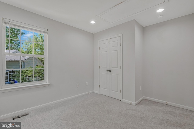 11587 Wollaston Cir, Swan Point, MD 20645 - unfurnished bedroom featuring attic access, carpet, baseboards, a closet, and recessed lighting