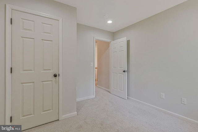 11587 Wollaston Cir, Swan Point, MD 20645 - unfurnished bedroom with baseboards and carpet flooring