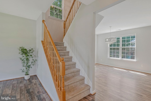 11587 Wollaston Cir, Swan Point, MD 20645 - staircase with wood finished floors and baseboards