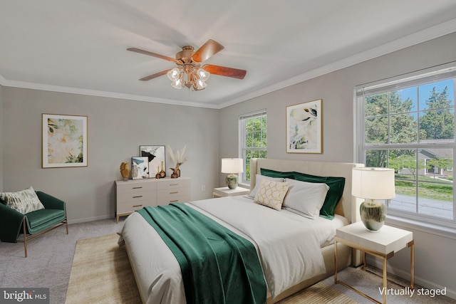 11587 Wollaston Cir, Swan Point, MD 20645 - carpeted bedroom featuring multiple windows, baseboards, crown molding, and ceiling fan