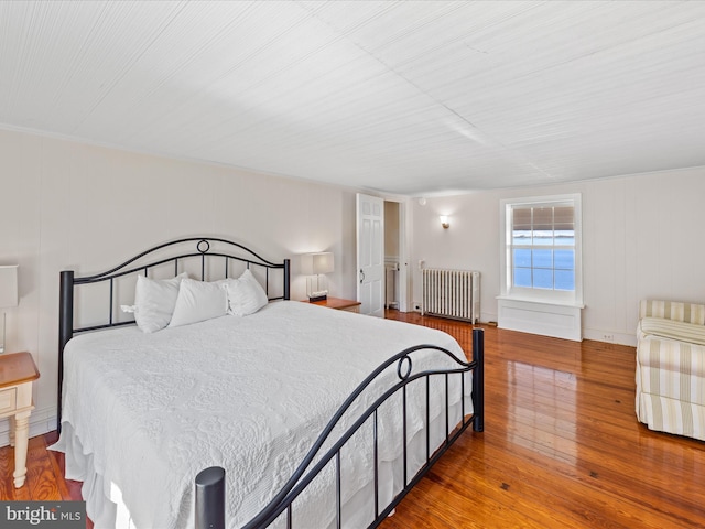 5917 Horns Point Rd, Cambridge, MD 21613 - bedroom with wood-type flooring and radiator heating unit