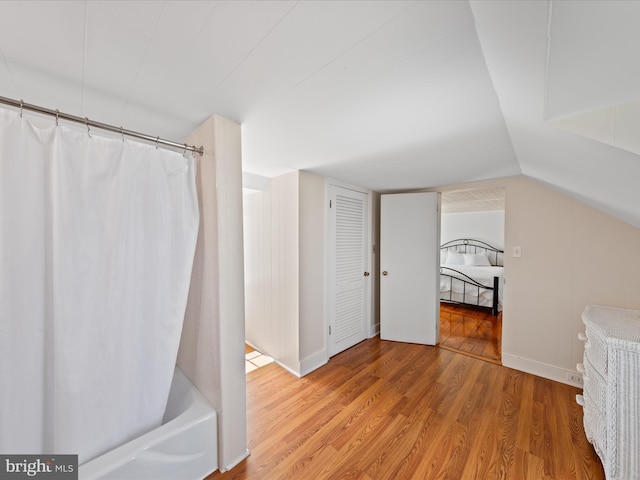 5917 Horns Point Rd, Cambridge, MD 21613 - full bath with shower / bath combo, wood finished floors, and lofted ceiling