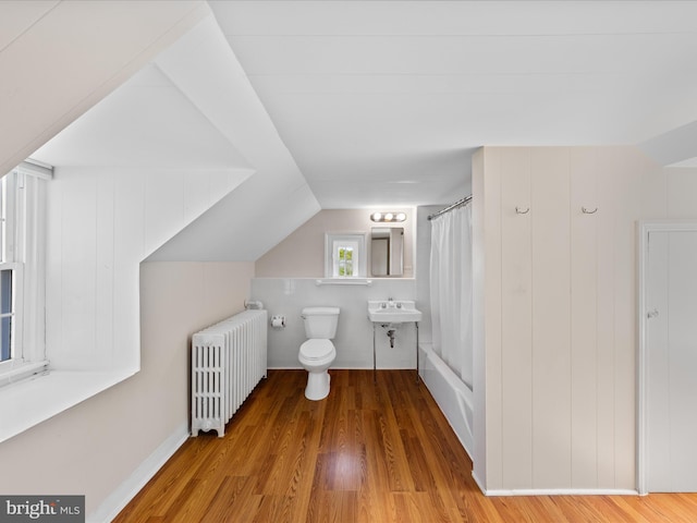 5917 Horns Point Rd, Cambridge, MD 21613 - full bathroom with radiator, a sink, toilet, shower / tub combo, and wood finished floors