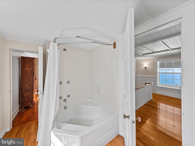 5917 Horns Point Rd, Cambridge, MD 21613 - bathroom featuring shower / bath combo with shower curtain, wood finished floors, and a wainscoted wall