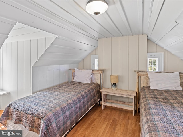 5917 Horns Point Rd, Cambridge, MD 21613 - bedroom with wood finished floors, wooden walls, and lofted ceiling