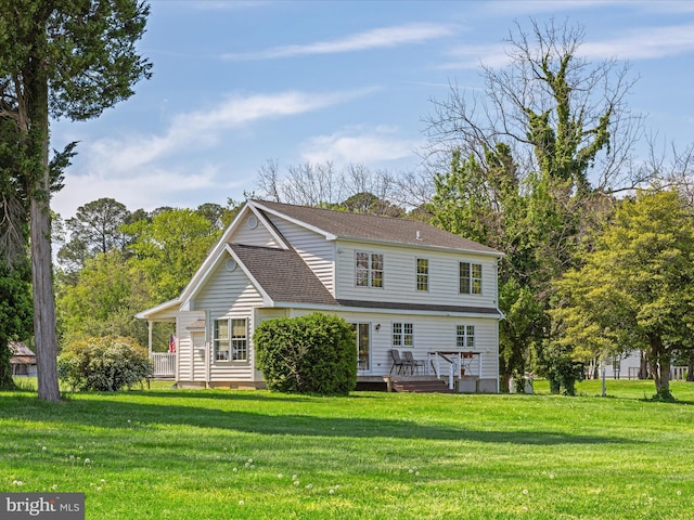 5917 Horns Point Rd, Cambridge, MD 21613 - rear view of property featuring a lawn, a deck, and a shingled roof