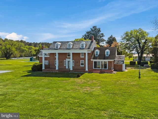 5917 Horns Point Rd, Cambridge, MD 21613 - view of front of home featuring a chimney, brick siding, and a front yard