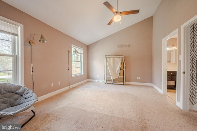 961 Rue Madora, Bear, DE 19701 - living area with baseboards, visible vents, ceiling fan, high vaulted ceiling, and light colored carpet