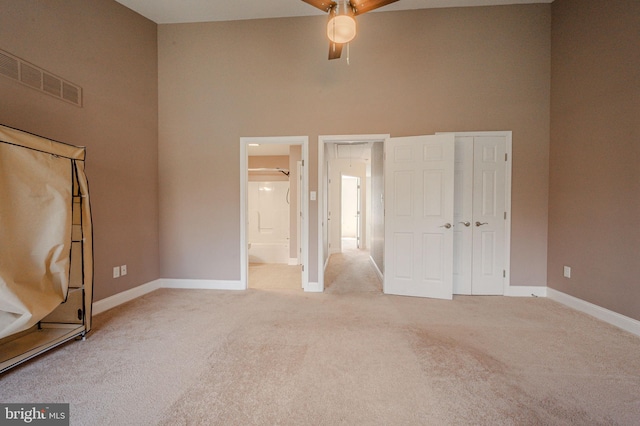 961 Rue Madora, Bear, DE 19701 - unfurnished bedroom with baseboards, light carpet, a towering ceiling, and visible vents