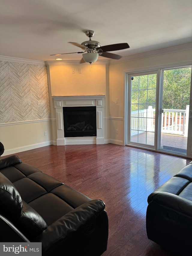 961 Rue Madora, Bear, DE 19701 - living area featuring baseboards, ornamental molding, ceiling fan, a fireplace, and wood finished floors