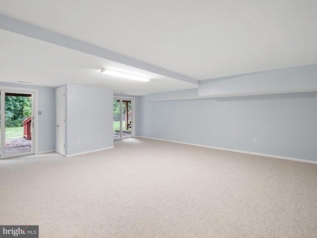 998 Glackens Ln, Wilmington, DE 19808 - below grade area with light carpet, baseboards, and plenty of natural light