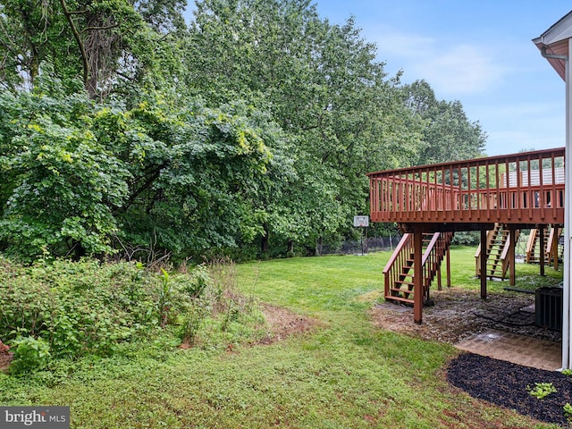 998 Glackens Ln, Wilmington, DE 19808 - view of grassy yard with stairway, a deck, and central air condition unit