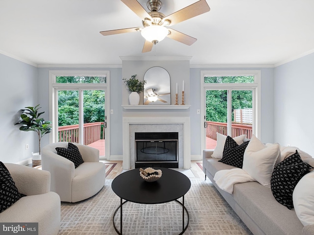 998 Glackens Ln, Wilmington, DE 19808 - living room with crown molding, a high end fireplace, ceiling fan, baseboards, and wood finished floors
