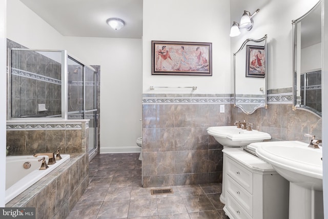 bathroom with visible vents, a shower stall, toilet, and a bath