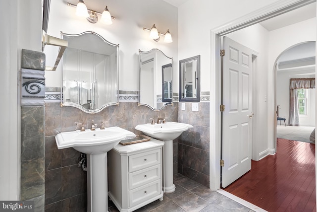 bathroom featuring tile walls and wainscoting