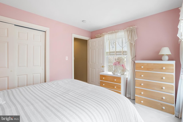 bedroom with light colored carpet