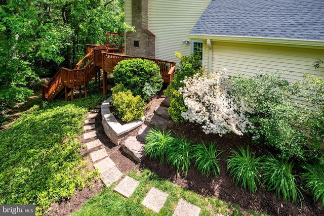 view of yard with stairs and a wooden deck