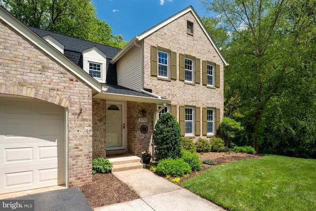 10702 Dundas Oak Ct, Burke, VA 22015 - view of front of house with an attached garage, a shingled roof, brick siding, and a front lawn