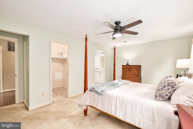 10702 Dundas Oak Ct, Burke, VA 22015 - carpeted bedroom featuring a closet, visible vents, a ceiling fan, a walk in closet, and baseboards