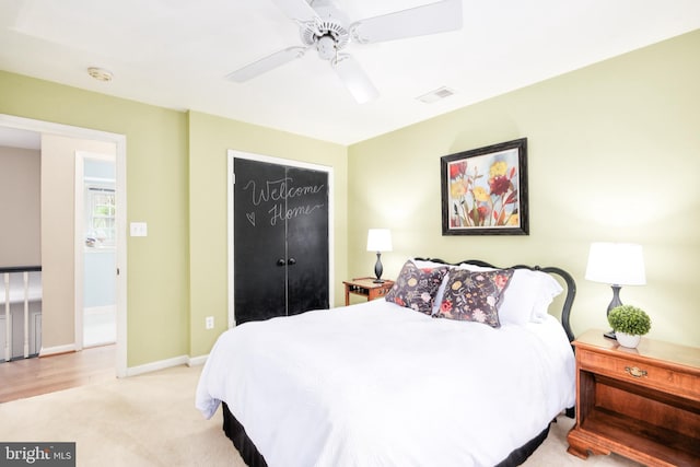 10702 Dundas Oak Ct, Burke, VA 22015 - bedroom with a closet, baseboards, ceiling fan, visible vents, and light colored carpet
