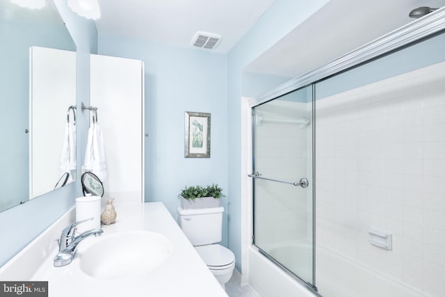 10702 Dundas Oak Ct, Burke, VA 22015 - full bathroom with vanity, toilet, shower / bath combination with glass door, and visible vents