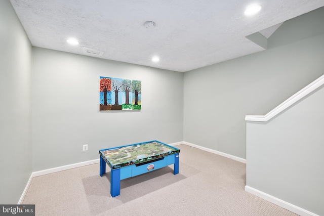 10702 Dundas Oak Ct, Burke, VA 22015 - rec room with baseboards, a textured ceiling, recessed lighting, and carpet floors