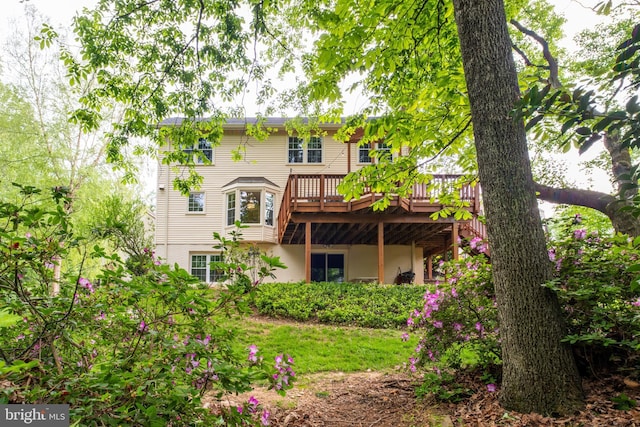 rear view of property with a deck