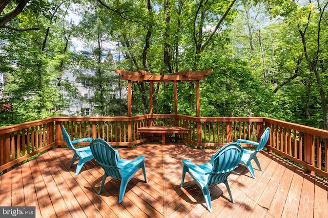 wooden deck featuring a pergola